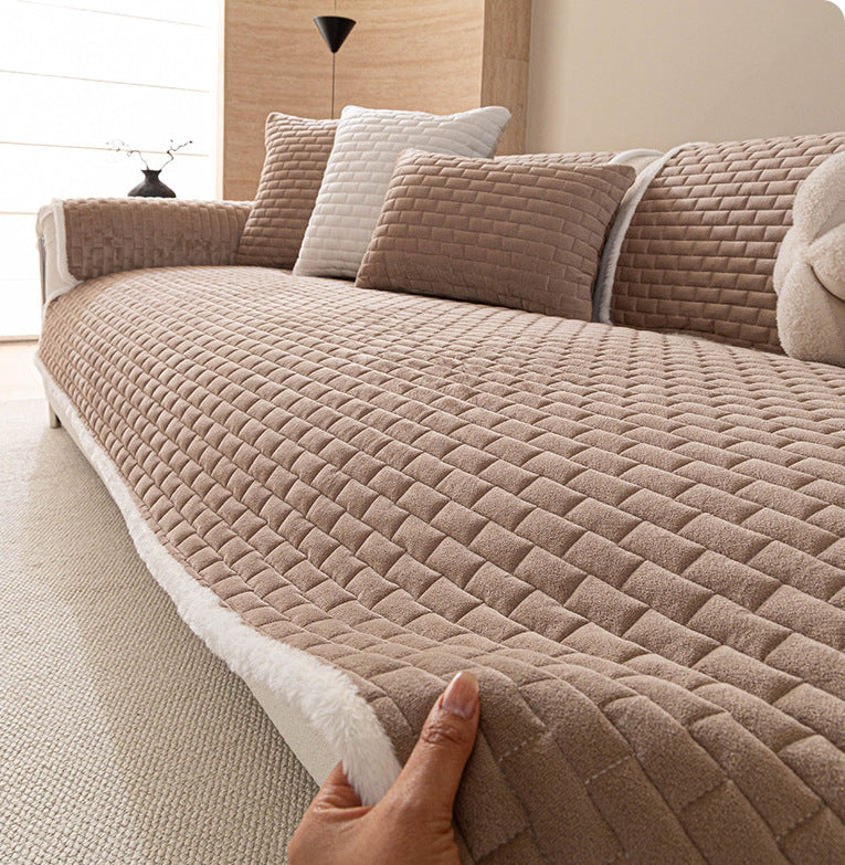 Plush edge of the khaki sofa cover