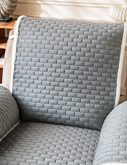Grey plush recliner cover close up