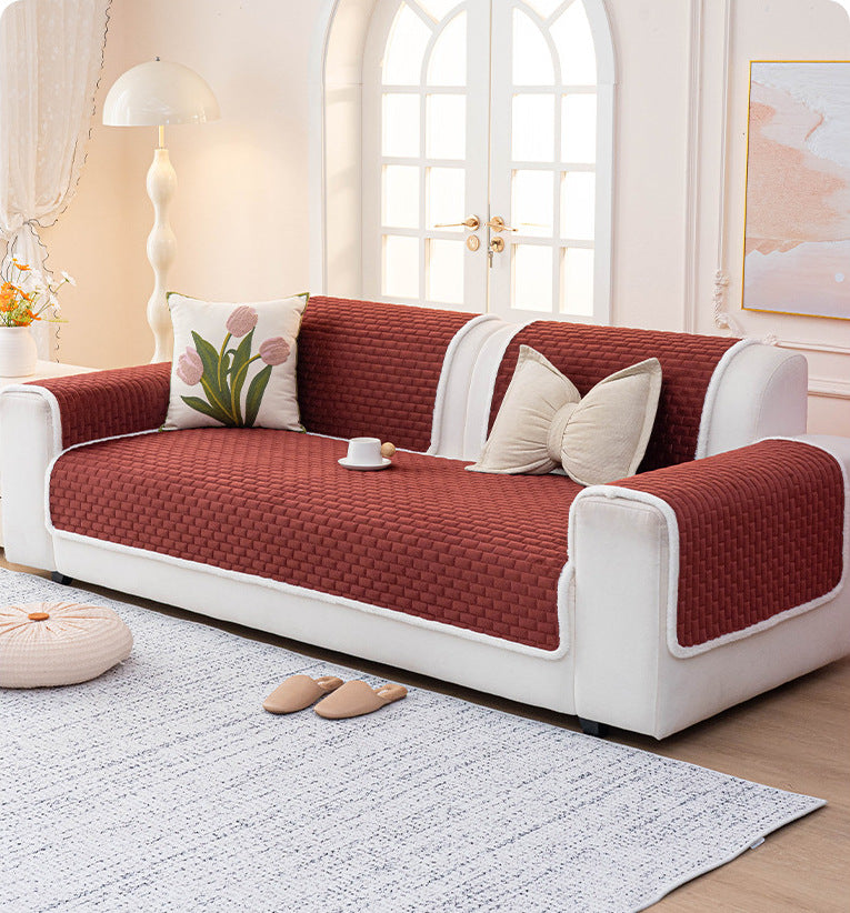 Wine red quilted sofa cover on a full sofa