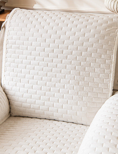 Off-white plush recliner cover close up