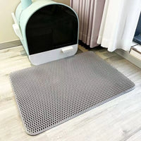 Gray double-layer litter mat in front of a litter box