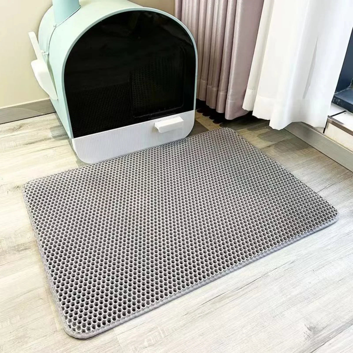 Gray double-layer litter mat in front of a litter box