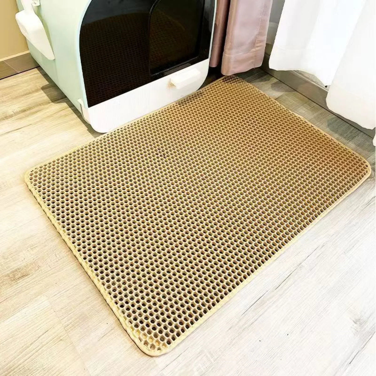 Sand double-layer litter mat in front of a litter box