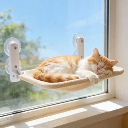 Cat lying in a beige mesh window hammock
