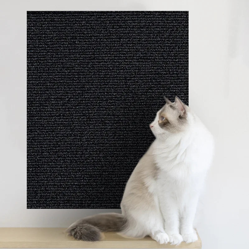 Black self-adhesive cat scratch mat on a wall