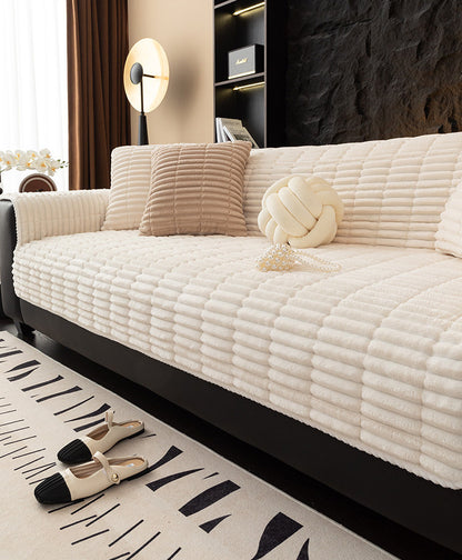 Cream flannel couch cover on sofa
