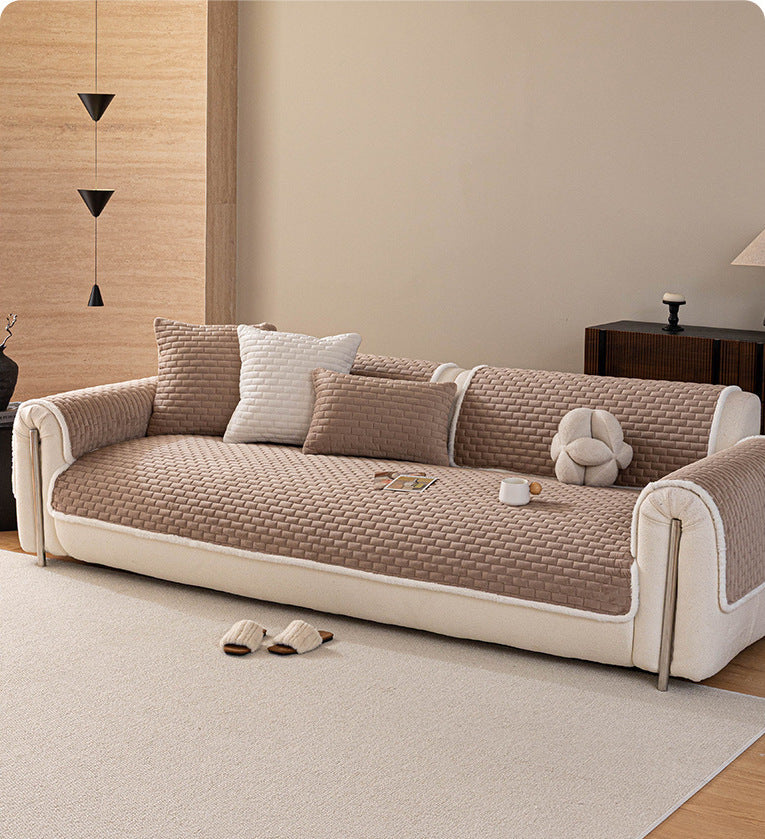 Khaki quilted sofa cover on a full sofa