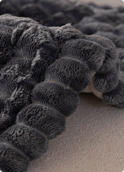 Bound edge of the plush couch cover