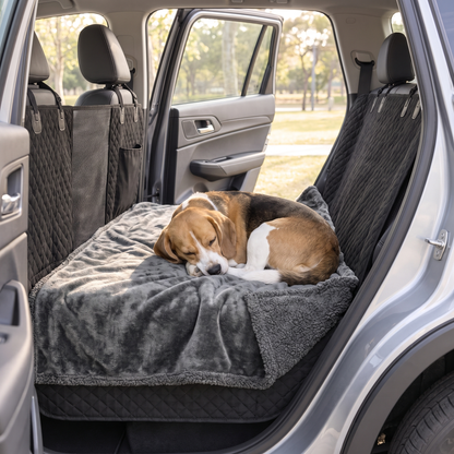 Beagle asleep on the gray fleece and sherpa backseat blanket
