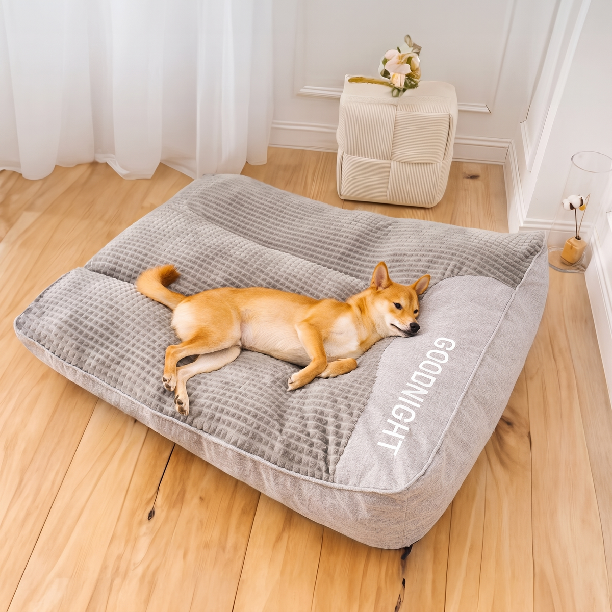 Gray velvet dog bed with a shiba inu